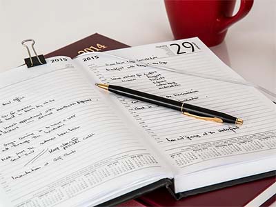 an open journal with pen